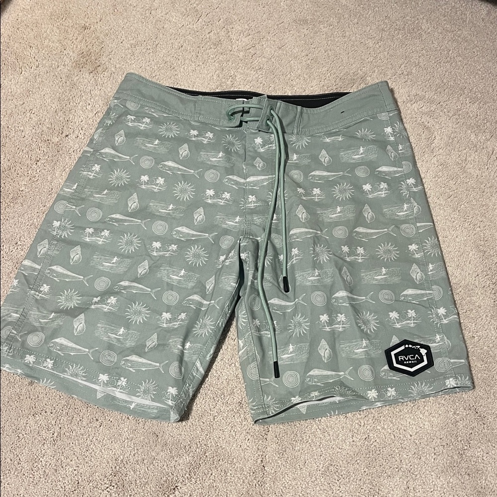 size 30 men’s RVCA green and white board shorts with beach pattern